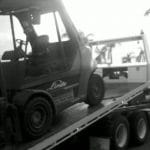 Heavy Duty Tow Truck Towing A Forklift Truck